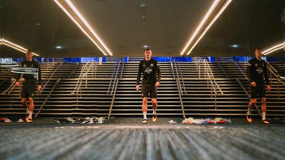 PREPARATIONS : Erling Haaland makes his way out onto the Etihad pitch