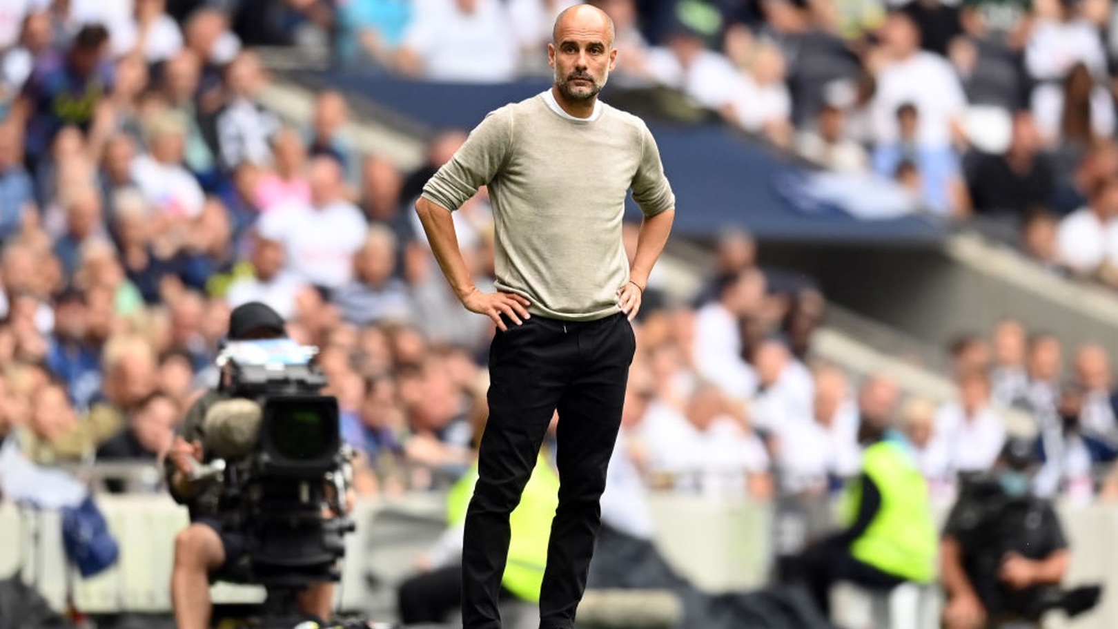 THE BOSS: Guardiola watches on from the touchline.