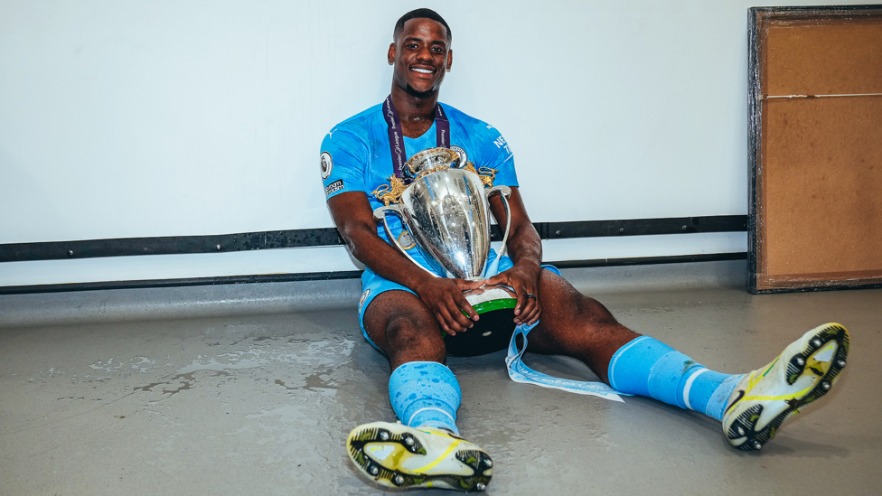 BACK-TO-BACK : Luke Mbete pictured with the PL2 trophy after our Everton triumph | 29 April 2022.