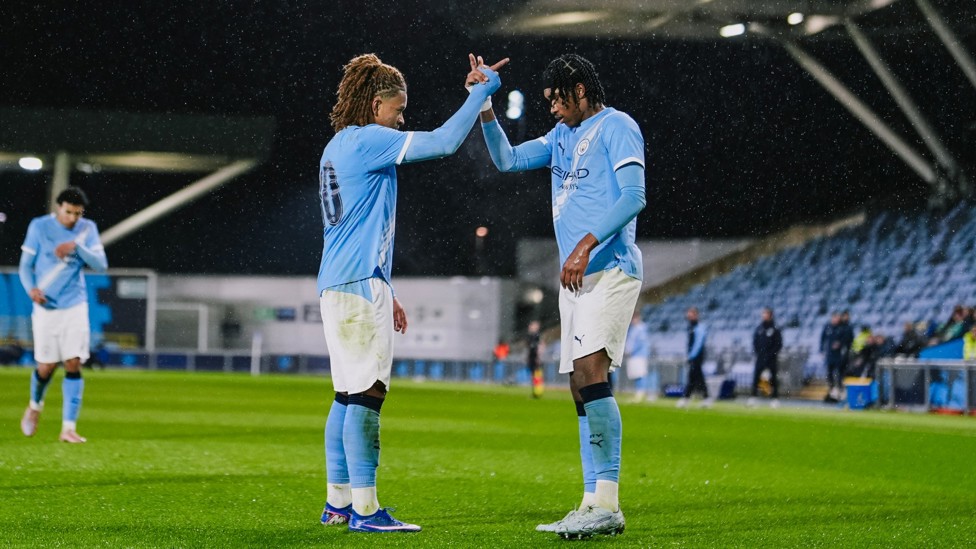STRIKE A POSE : Tyrone Samba and Reigan Heskey celebrate after their clinical link-up for City's second.