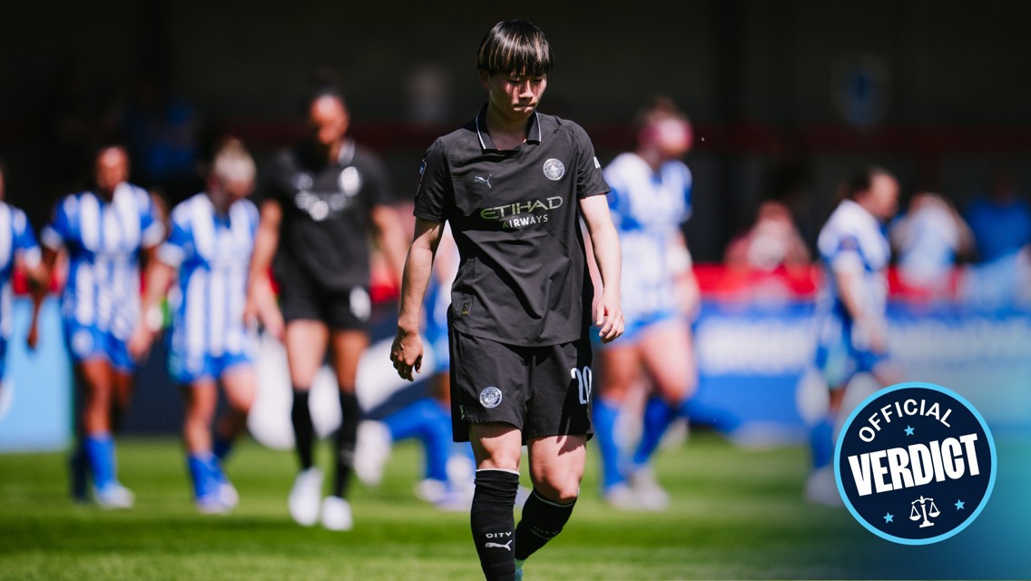 Players on a football field wearing kits; black kit has logo and Etihad sponsor. 'Official Verdict' badge on the bottom right corner.