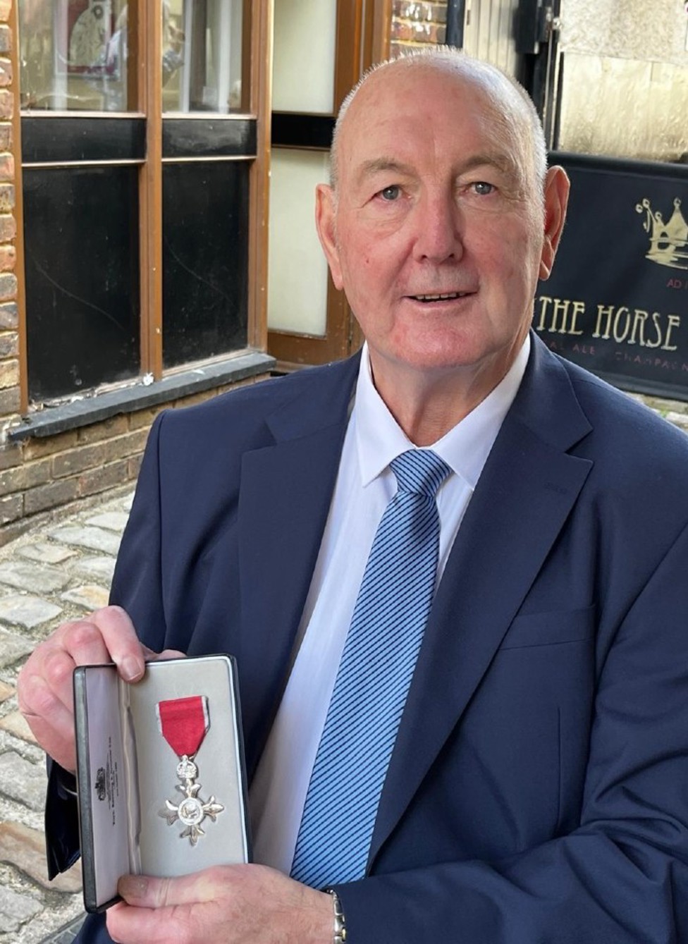 PROUD MOMENT: Joe with his MBE