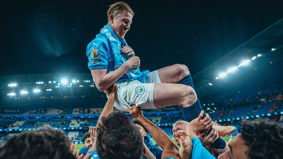 MR BUMP : King Kev celebrates with teammates during the post-match celebrations to honour him after the Bournemouth win