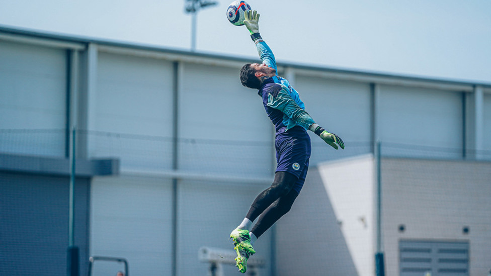JUMP TO IT: Ederson leaps to deflect away this high ball