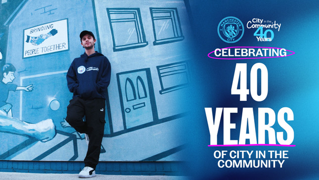 A person in a Man City Community hoodie stands in front of a mural with 'Bringing People Together' accompanied by text celebrating 40 years of 'City in the Community' with Manchester City logos.
