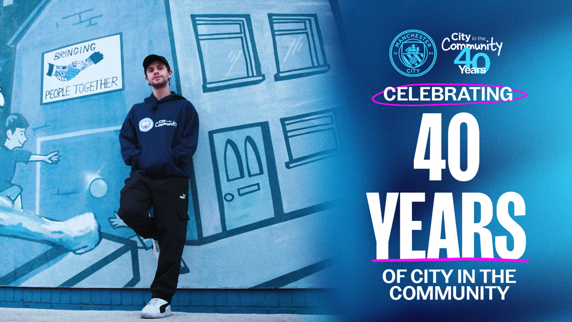 A person in a Man City Community hoodie stands in front of a mural with 'Bringing People Together' accompanied by text celebrating 40 years of 'City in the Community' with Manchester City logos.