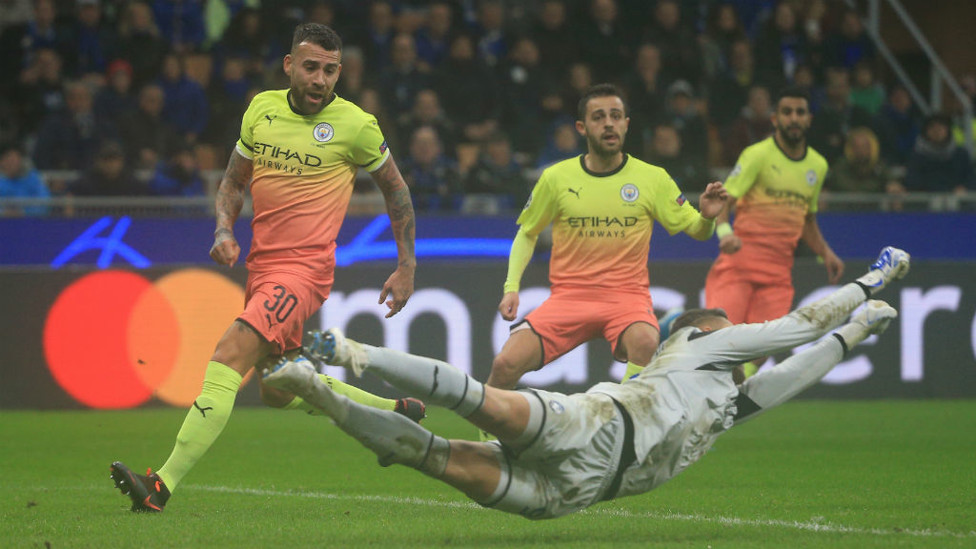AT FULL STRETCH : Atalanta keeper Pierluigi Gollini dives to punch clear as City sweep forward