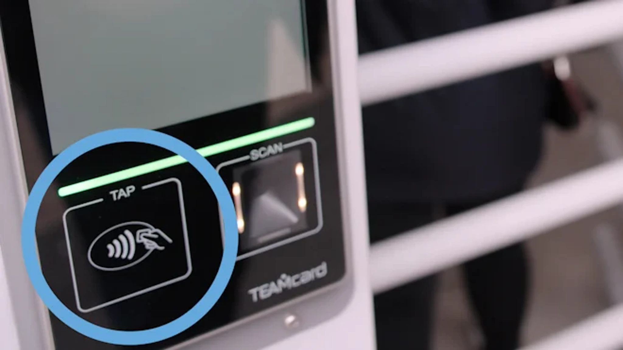 Image of a contactless payment terminal with a highlighted tap section for card or phone. The screen displays the phrases 'TAP' and 'SCAN'.