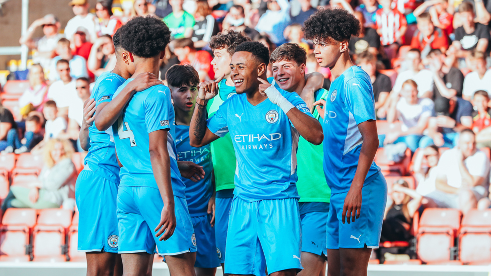 ALL TOGETHER NOW : The lads congratulate Tai after he draws City level