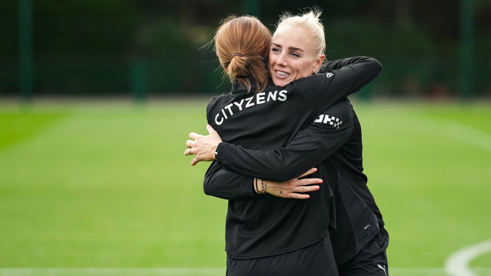 WELCOME BACK : Alex Greenwood gets a hug on her return