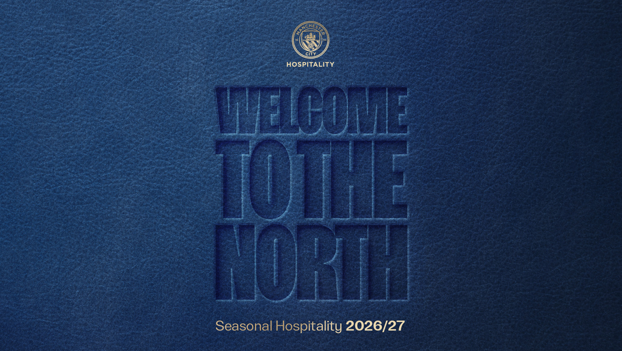 Blue background with embossed text 'Welcome to the North' and 'Seasonal Hospitality 2026/27'. Top includes a logo with 'Manchester City Hospitality'.