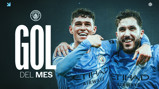 Football players in Manchester City kits celebrating; 'Gol del Mes' text with Manchester City logo visible.