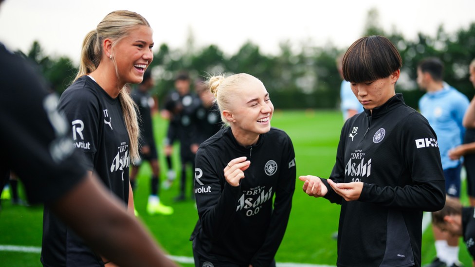 ALL SMILES: Poppy Pritchard, Laura Blindkilde Brown and Aoba Fujino share in a light-hearted moment.