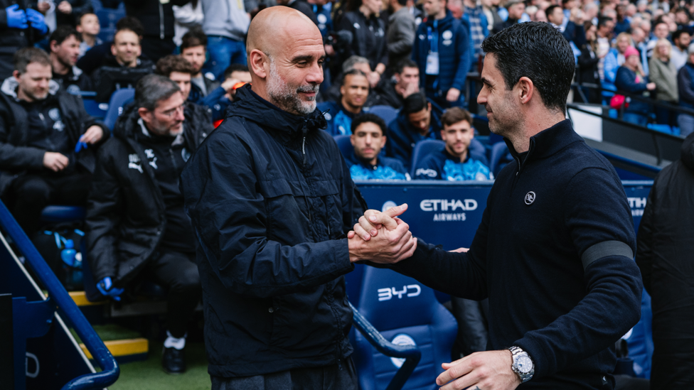 BOSSES : Guardiola and Arteta share a warm embrace ahead of kick-off.