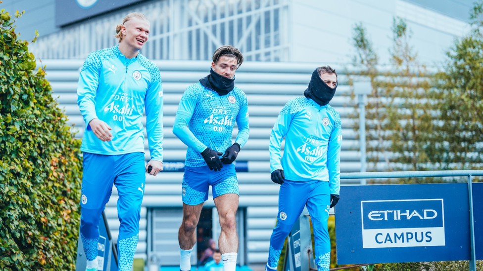 THREE MUSTKETEERS : Erling Haaland, Jack Grealish and Bernardo Silva make their way onto the pitch.