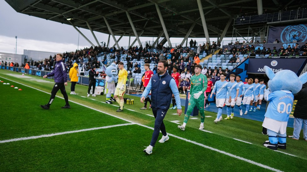 LEADING THE TEAM : Oliver Reiss leads his City team out on to the pitch.