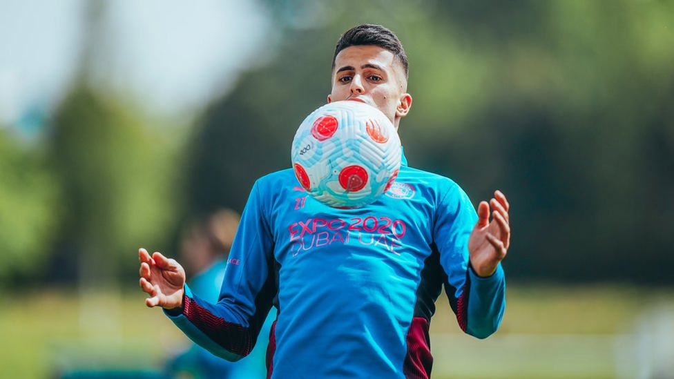 TAKE IT DOWN : Joao Cancelo watches the ball onto his chest