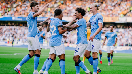 ALL SMILES: The players show their delight.