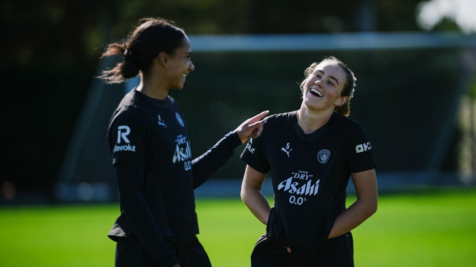 NEW FACES : Summer signings Jade Rose and Grace Clinton share a joke