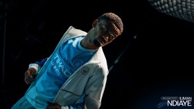 Person wearing Manchester City shirt with Etihad Airways logo, accompanied by text welcoming Iliman Ndiaye.