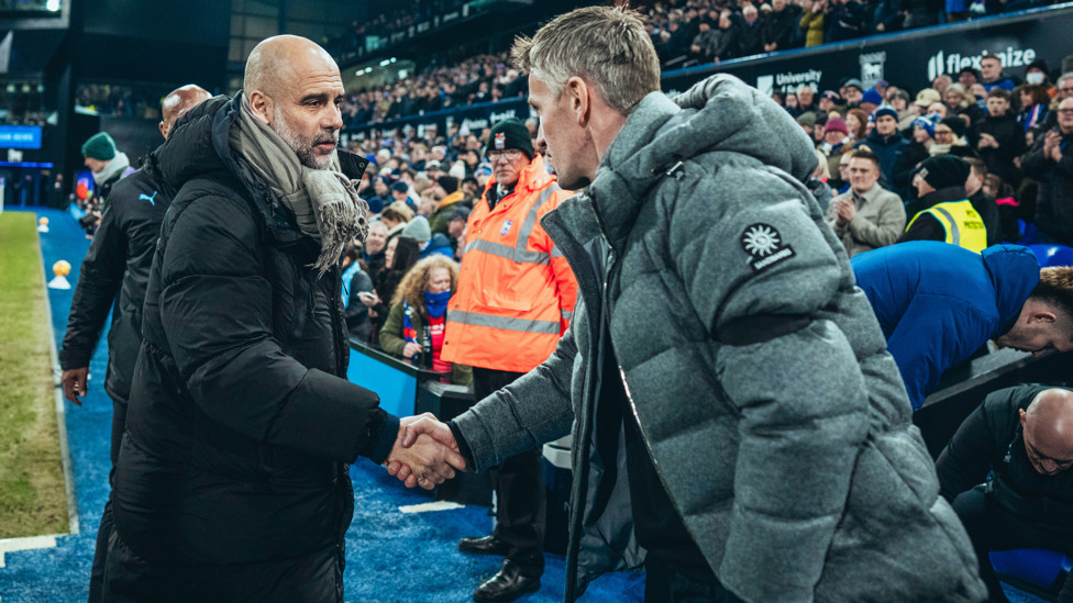 BOSSES : Guardiola and McKenna share a warm embrace ahead of kick-off.