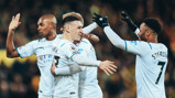 CENTRE OF ATTENTION: Foden is congratulated after his goal.