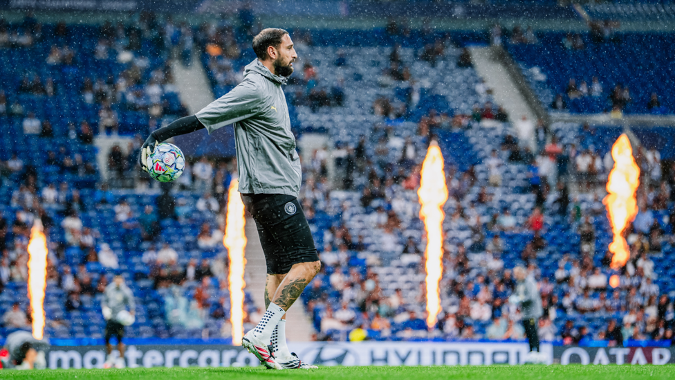 SAFE HANDS : Donnarumma gets a feel of the ball during the pre-match warm up.