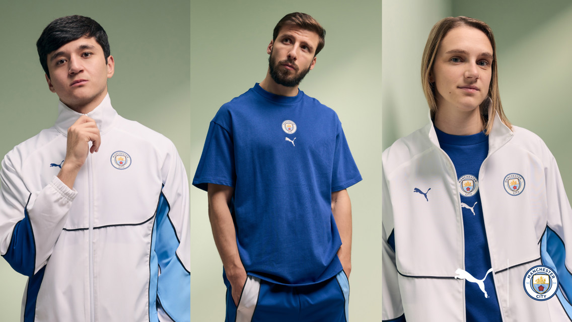 Three individuals wearing Manchester City and Puma branded clothing, featuring club crest and logo on a blue and white-themed fashion collection.