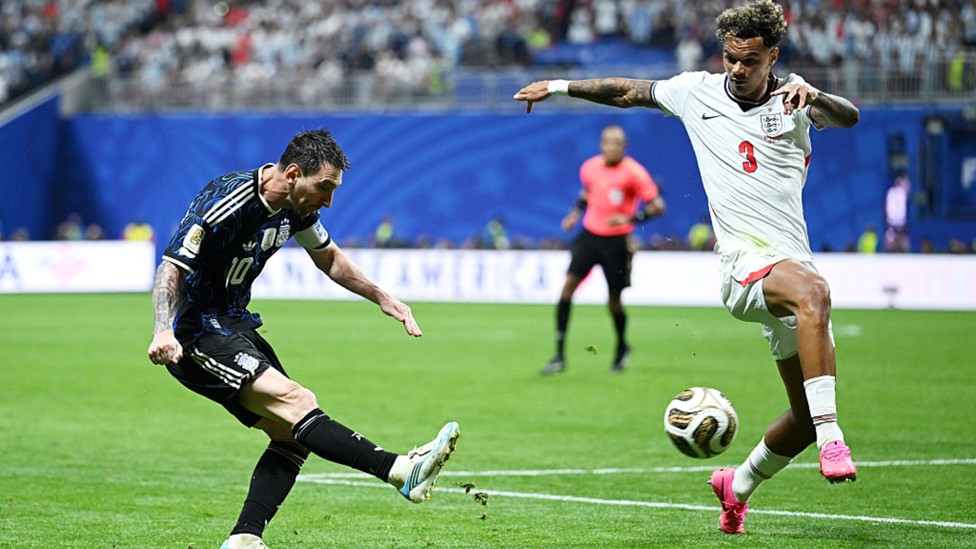 DANGER MAN: Nico O'Reilly vies with Lionel Messi