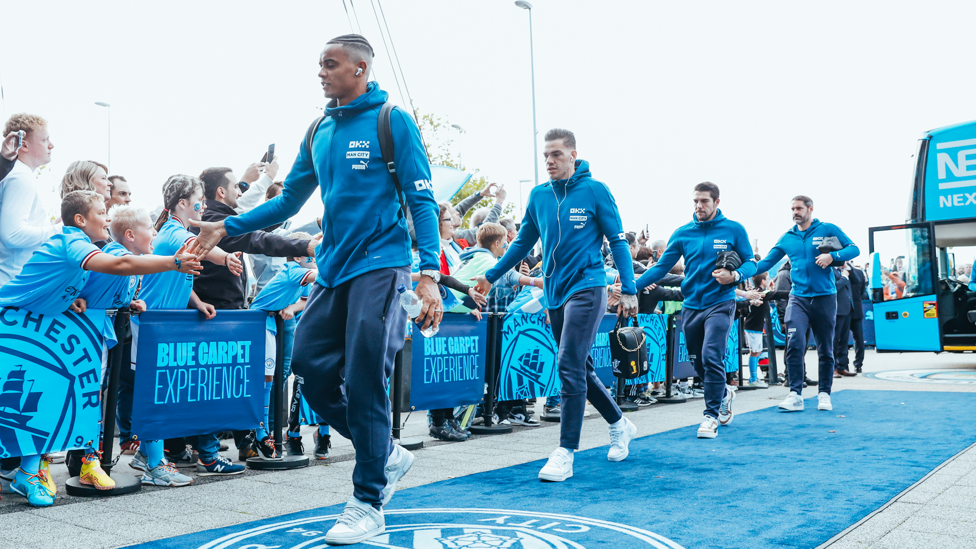 ARRIVAL : Akanji and co make their way into the Etihad ahead of Brighton's visit.