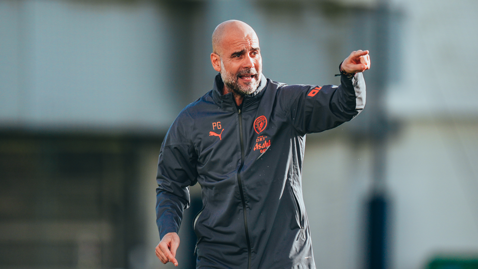 POINTING THE WAY : Pep Guardiola gives clear instructions to his players