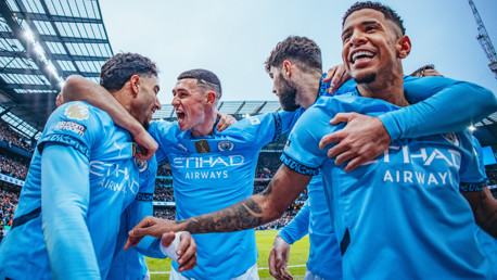 ALL SMILES: The players show their delight.