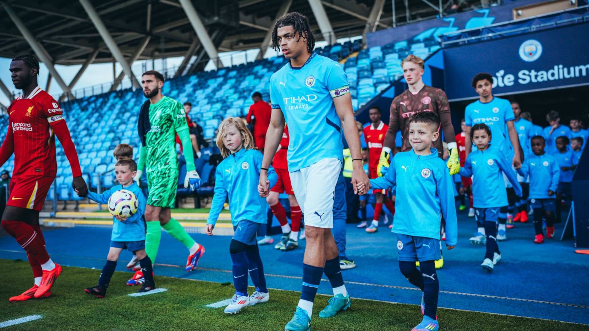 TAKING CENTRE STAGE : The squad takes to the pitch, led by captain Jahmai Simpson-Pusey.