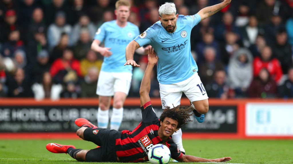 ACTION STATIONS: Nathan Ake goes crashing as he fends off Sergio Aguero