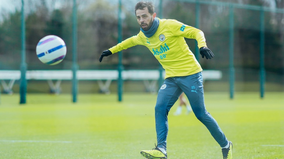 LOCKED IN : Bernardo Silva keeps his eyes on the ball