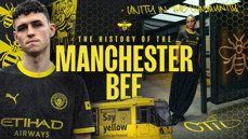 A Manchester City themed image featuring two people in Manchester City jerseys, a tram with the Bee Network logo, text about the history of the Manchester Bee, and bees as symbolic motifs.
