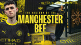 A Manchester City themed image featuring two people in Manchester City jerseys, a tram with the Bee Network logo, text about the history of the Manchester Bee, and bees as symbolic motifs.