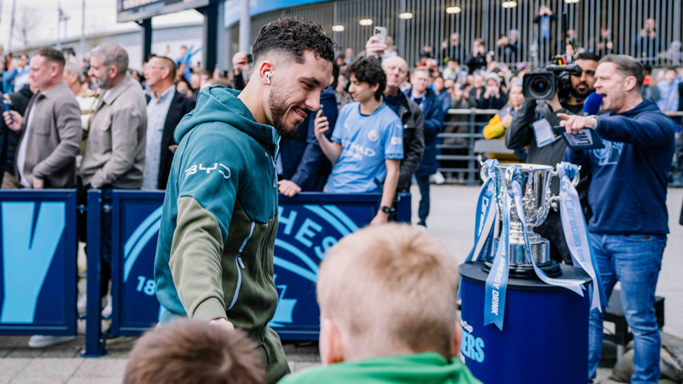 CHEEKY CHERKI : Smirks and high fives from Rayan on the way into the Etihad.