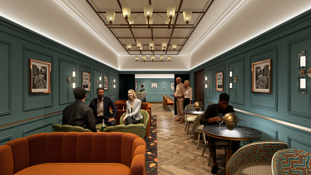 Elegant lounge with teal walls, framed photos, herringbone flooring, and multiple groups enjoying conversations and drinks in a cozy setting.