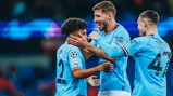ALL SMILES: Dias and Foden celebrate with Lewis.