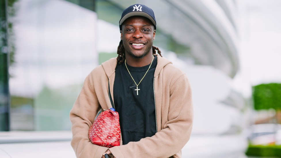 GOOD AFTERNOON! : Jeremy Doku smiles for the camera. 