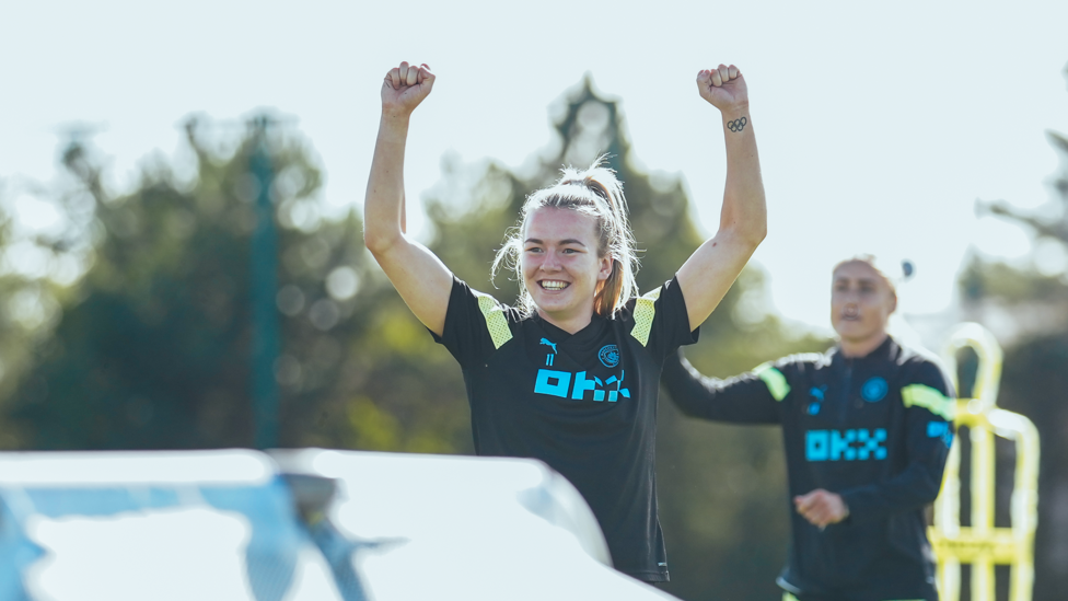 GUNS BLAZING  : Lauren Hemp lifts her arms in celebration 