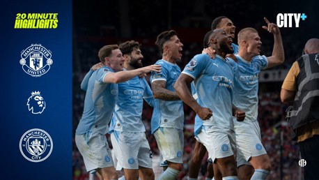 Group of Manchester City players celebrating a goal on the field. Manchester United and Premier League logos are on the left with 'CITY+' at the top right.