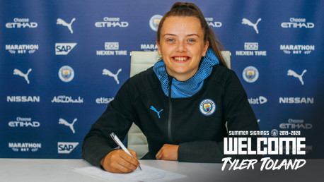 DONE DEAL: Tyler Toland looks delighted to sign for the Blues