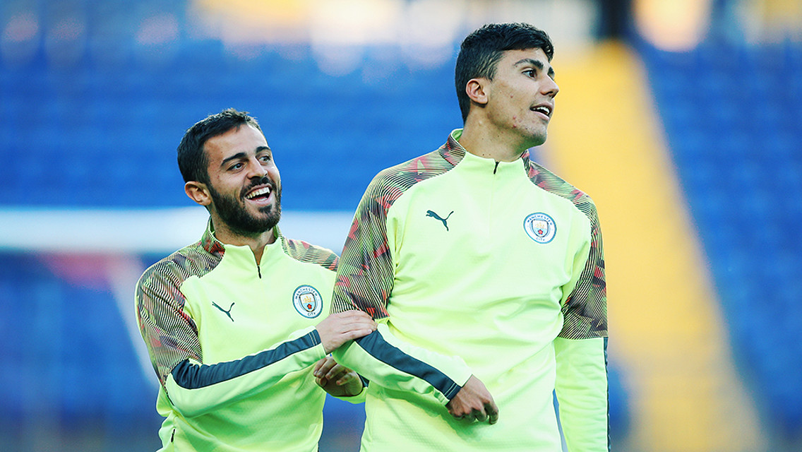 TWO'S COMPANY: Bernardo Silva and Rodrigo limber up ahead of tomorrow's Shakhtar clash