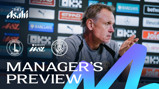 A football manager gestures while speaking during a press conference. The backdrop includes logos of Asahi, Barclays WSL, Charlton Athletic, and Manchester City. Text reads 'Manager's Preview'.