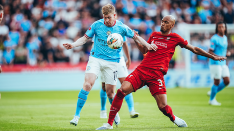 MIDFIELD MAYHEM: De Bruyne evades Fabinho's early challenge.