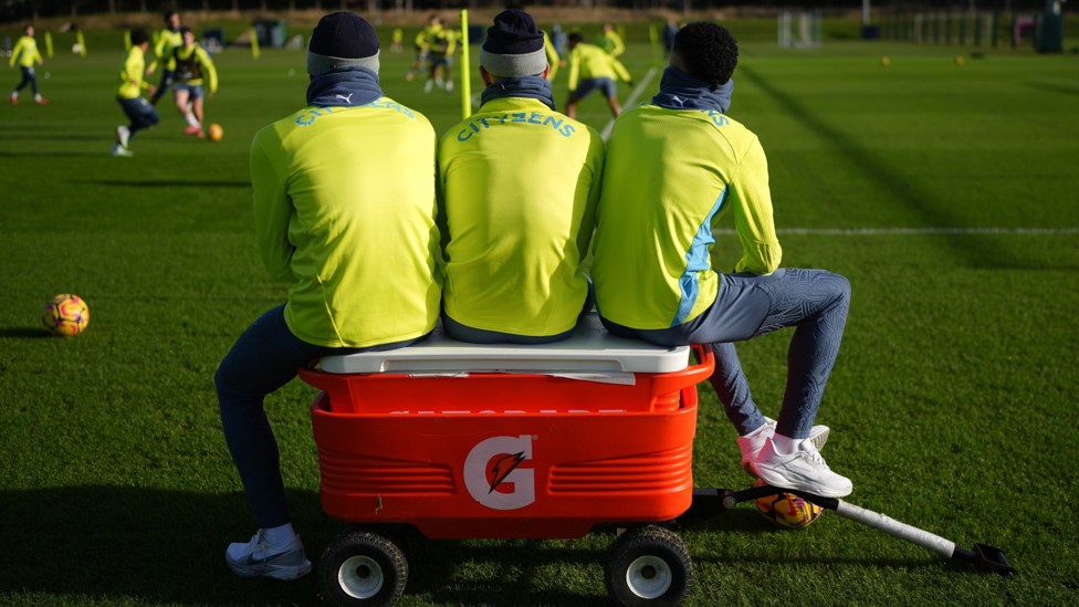 THREE WISE MEN : Savinho, Foden and Omar Marmoush take a break in training