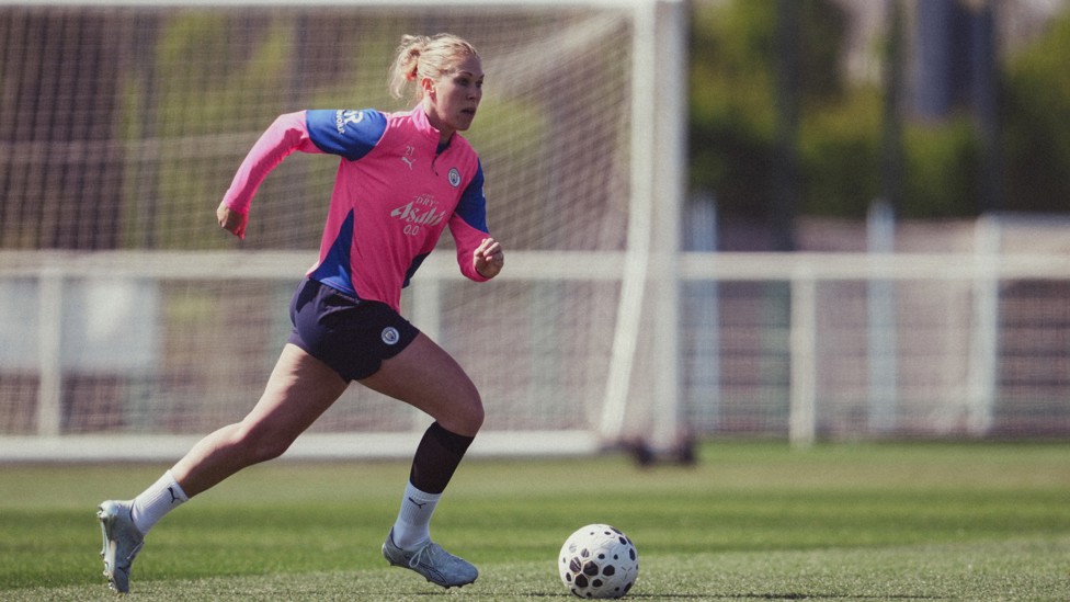 DEFENSIVE DUTIES : Rebecca Knaak brings the ball out