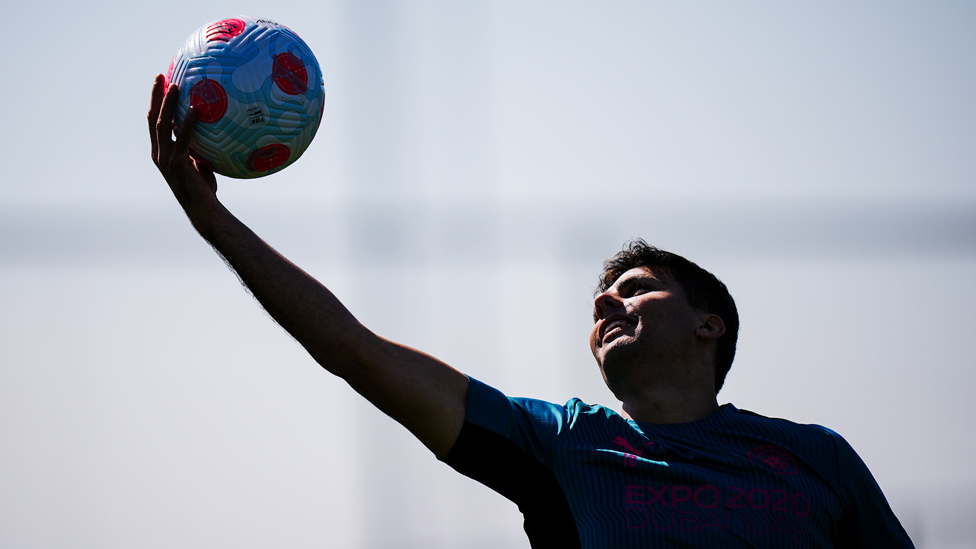 REACH : Rodrigo makes a grab for the ball.